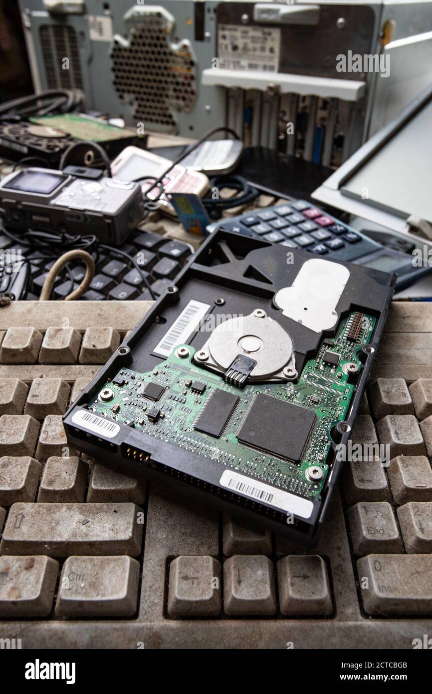 Close up on old computer hard drive on pile of electronic waste Stock