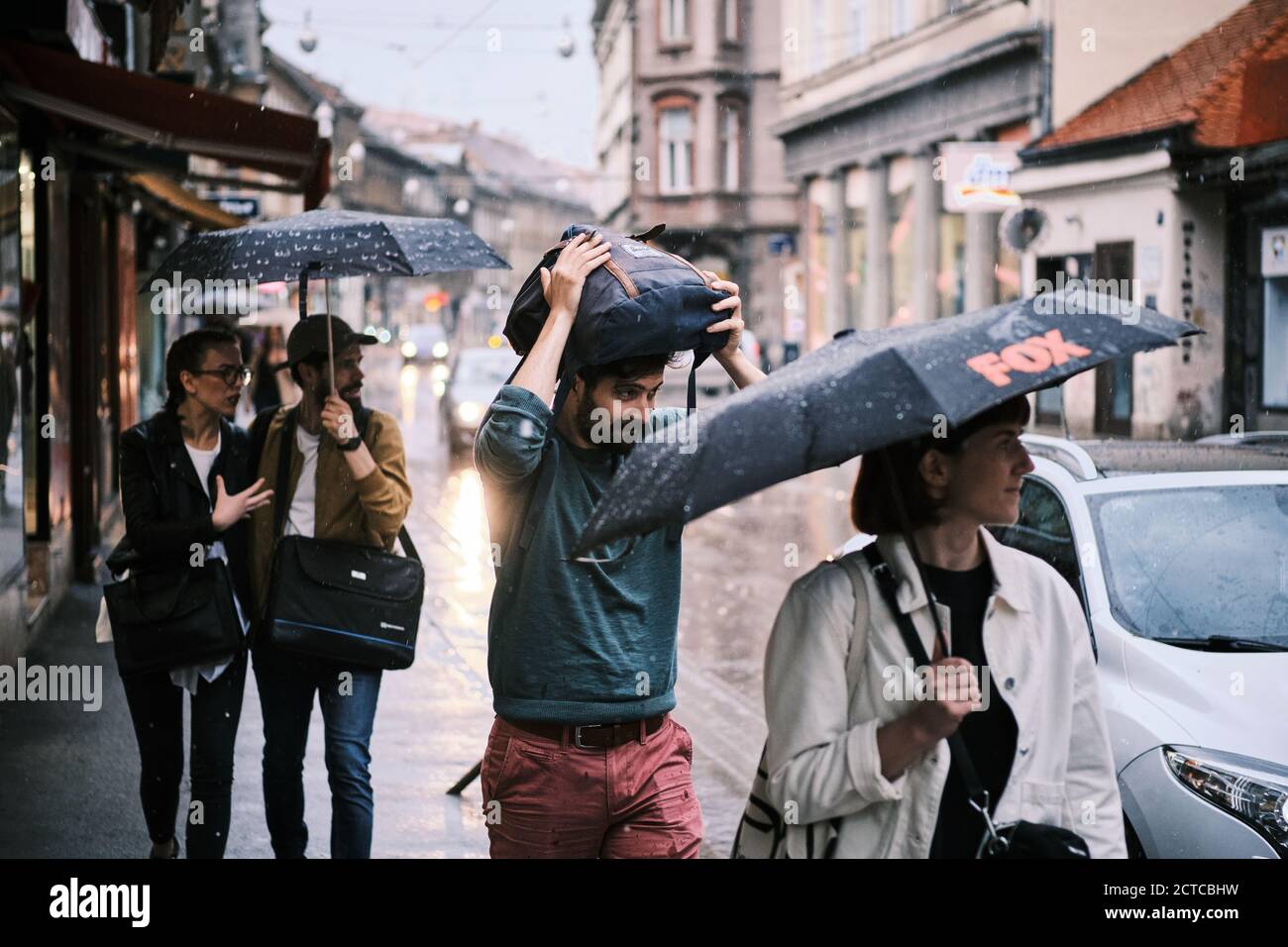People on the streets of Zagreb during a rainy day, Croatia Stock Photo