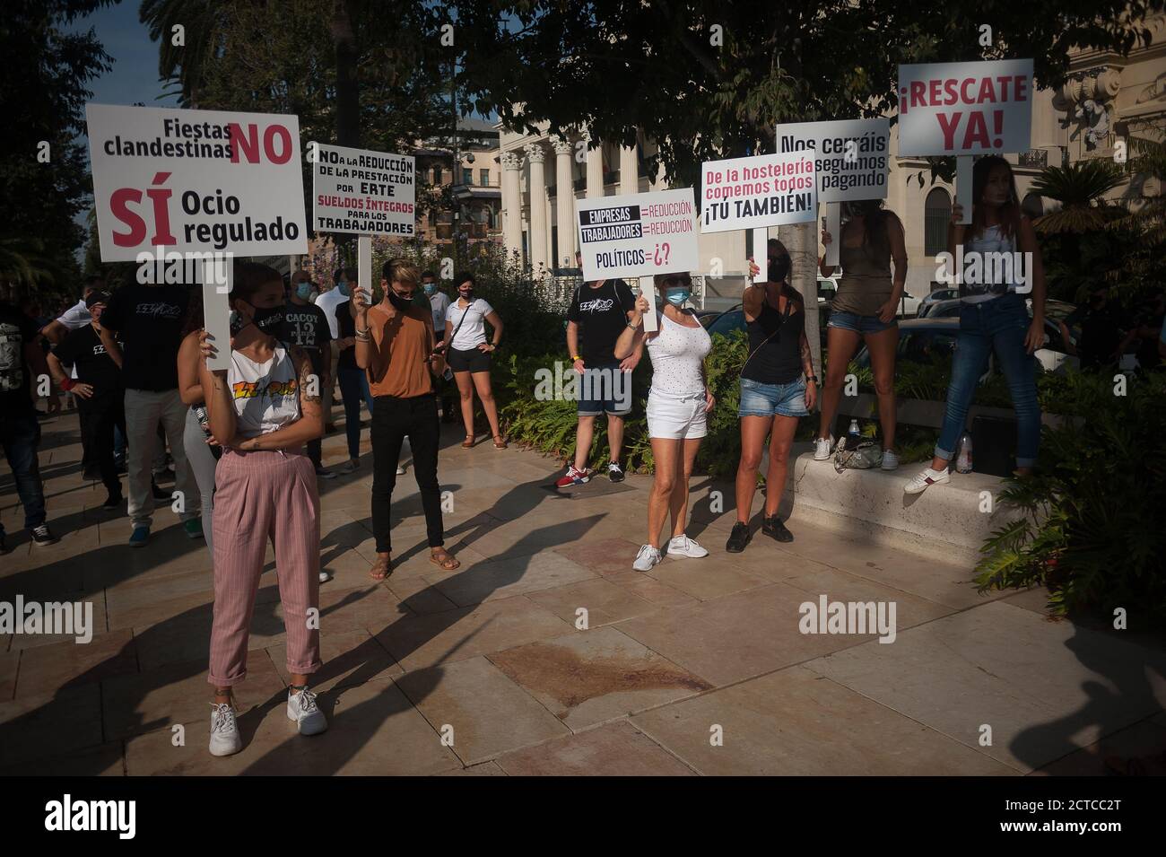 Malaga, Spain. 22nd Sep, 2020. Protesters wearing face masks hold
