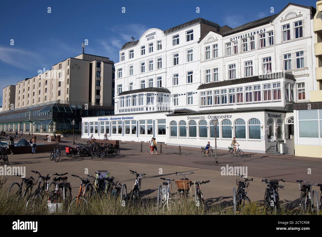 Only a few people on the promenade during the Corona pandemic on Borkum Island, Lower Saxony, Germany, Europe. Stock Photo