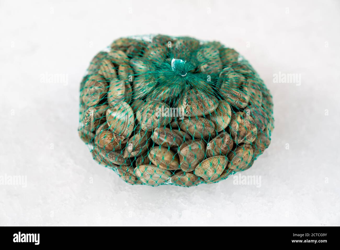 fresh raw seafood clams in the bag on ice,close up. Stock Photo