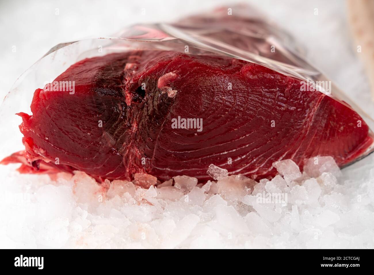 piece of red tuna on ice background,close up,typical fish of the Mediterranean sea , caught in Sicily. Stock Photo