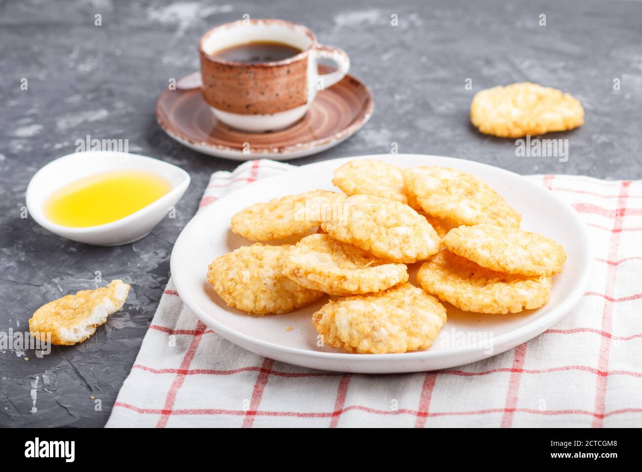 Traditional japanese rice chips cookies with honey and soy sauce on a ...