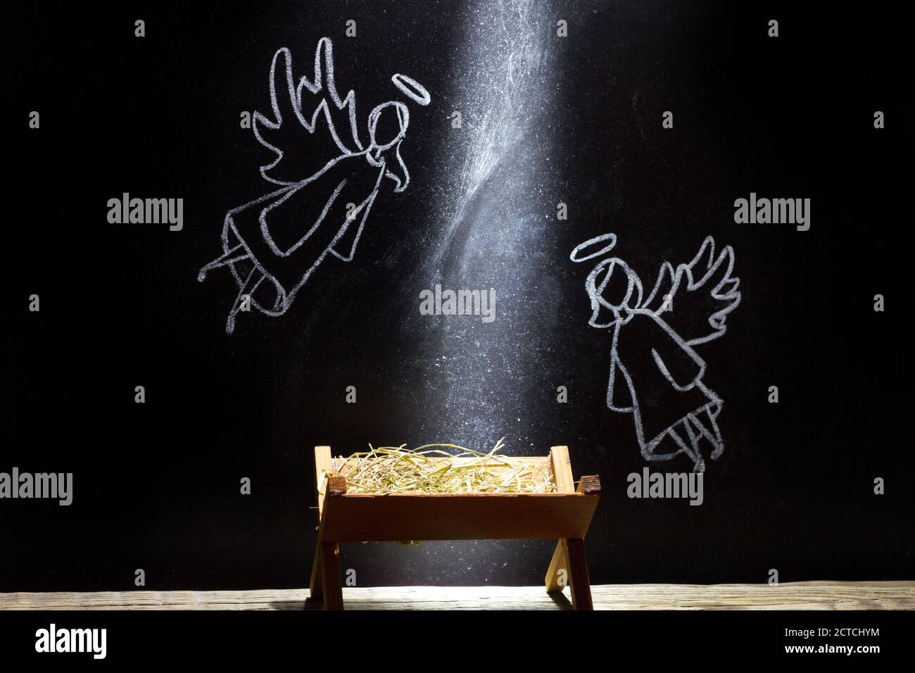 Birth of Jesus, manger and angels on blackboard abstract christmas nativity scene Stock Photo