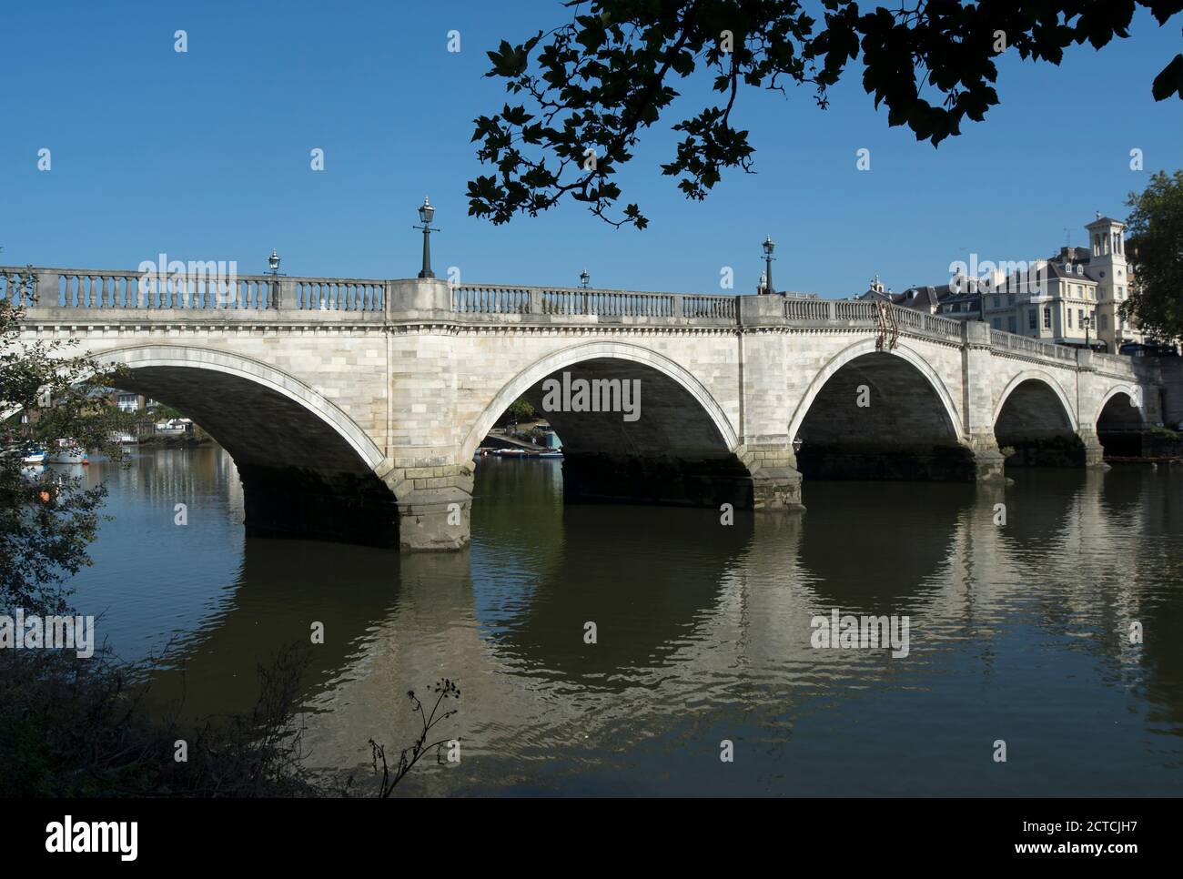 richmond bridge, spanning the river thames between richmond and east twickenham, seen from the twickenham side in early autumn Stock Photo