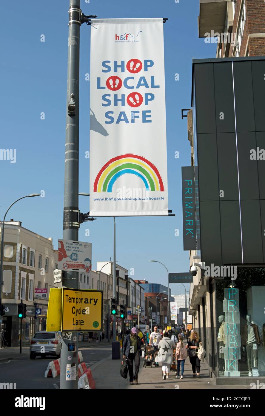 local authority shop local shop safe hanging sign above a busy street in hammersmith, london, england, during the covid 19 pandemic Stock Photo