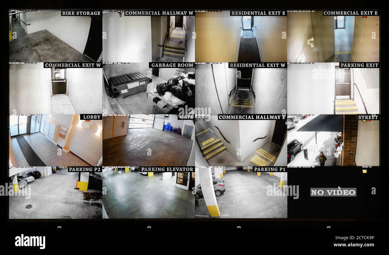 Security camera monitoring screen. 16 camera slots. Small high end system of residential, commercial or strata building. Parking, gate, garbage. Stock Photo