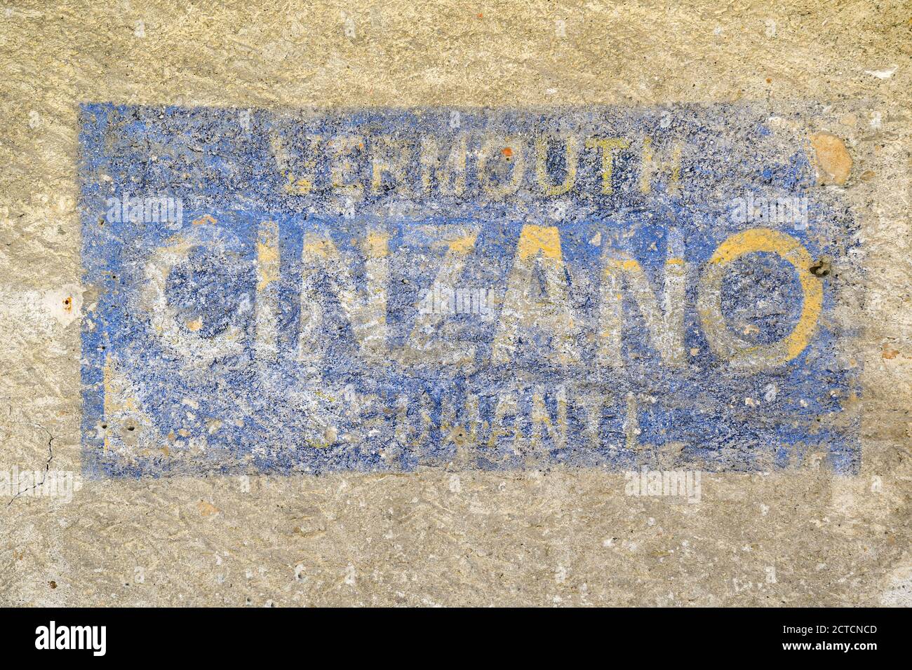 Close-up of an old, faded sign of the Cinzano alcohol industry on the weathered wall of a building in the centre of Courmayeur, Aosta Valley, Italy Stock Photo