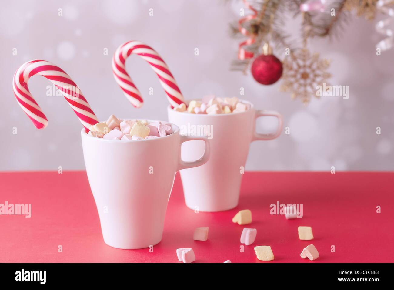 marshmallows and a cup of latte on a white table Stock Photo