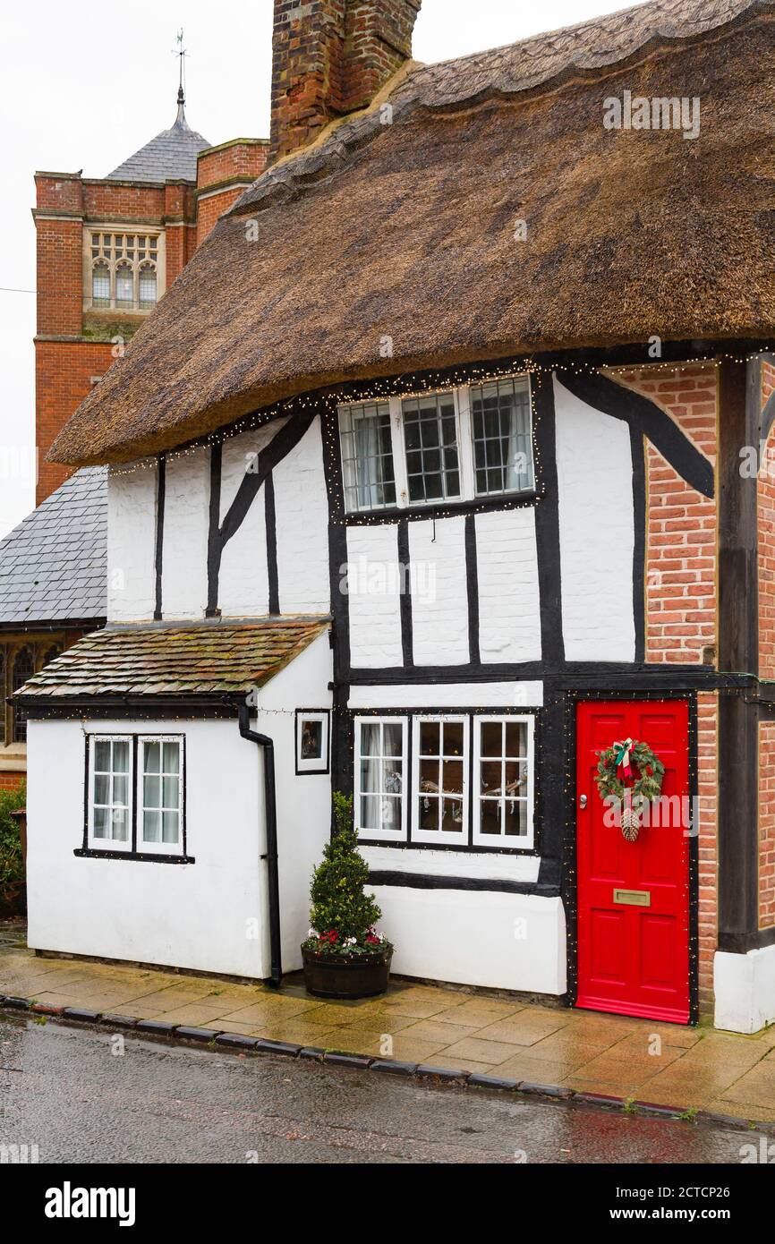 WINSLOW, UK - December 26, 2019. Facade of English thatched cottage house at Christmas, winter, England property in UK street scene Stock Photo