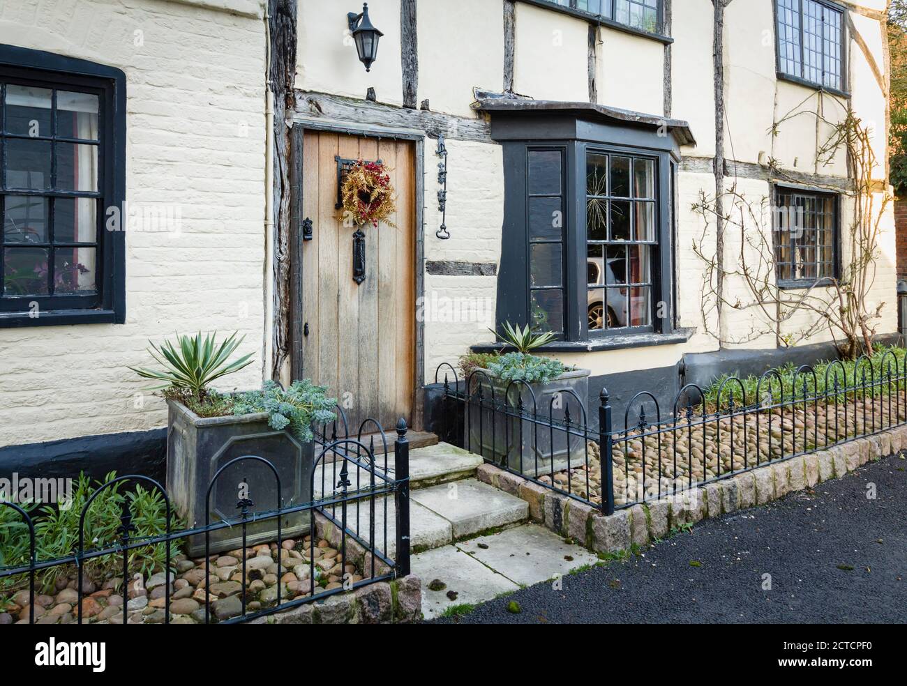 WINSLOW, UK - December 29, 2019. Facade of English period house or cottage in a historic UK town, with small front garden in Christmas, winter Stock Photo
