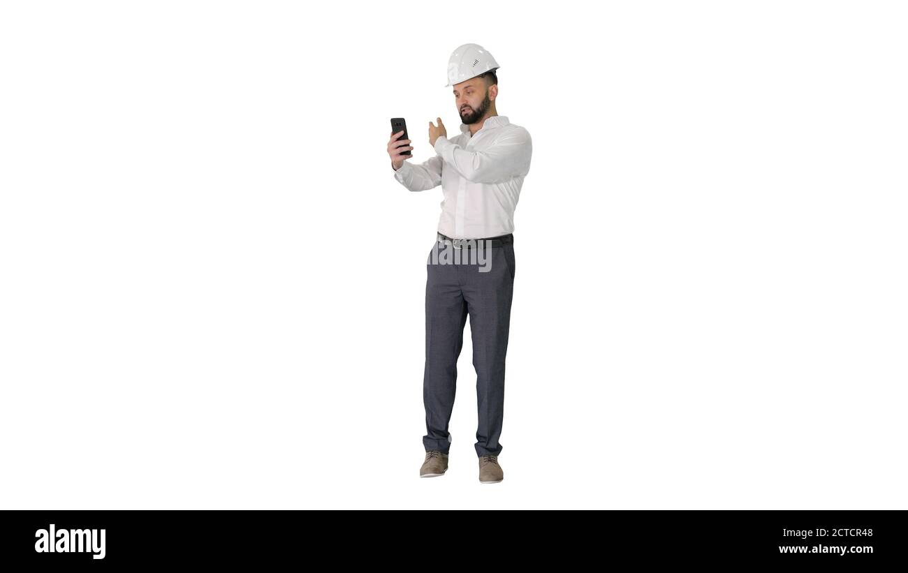 Man engineer wearing protecting safety helmet and shirt making v Stock Photo