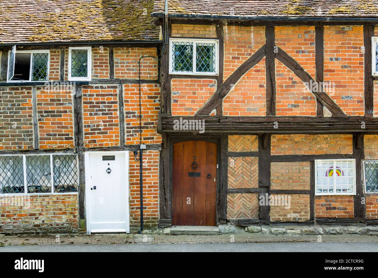 QUAINTON, UK - May 15, 2020. Row of old timber frame cottages in a Buckinghamshire village, UK Stock Photo