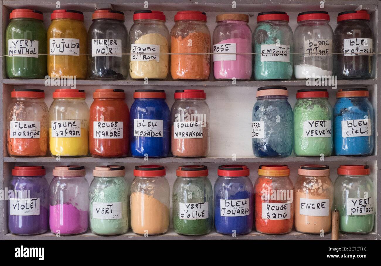 Jars of natural coloured dyes used to colour material and clothes found widely throughout Morocco Stock Photo