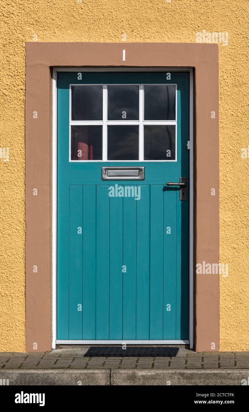 Blue front door with number 1 above. Stock Photo