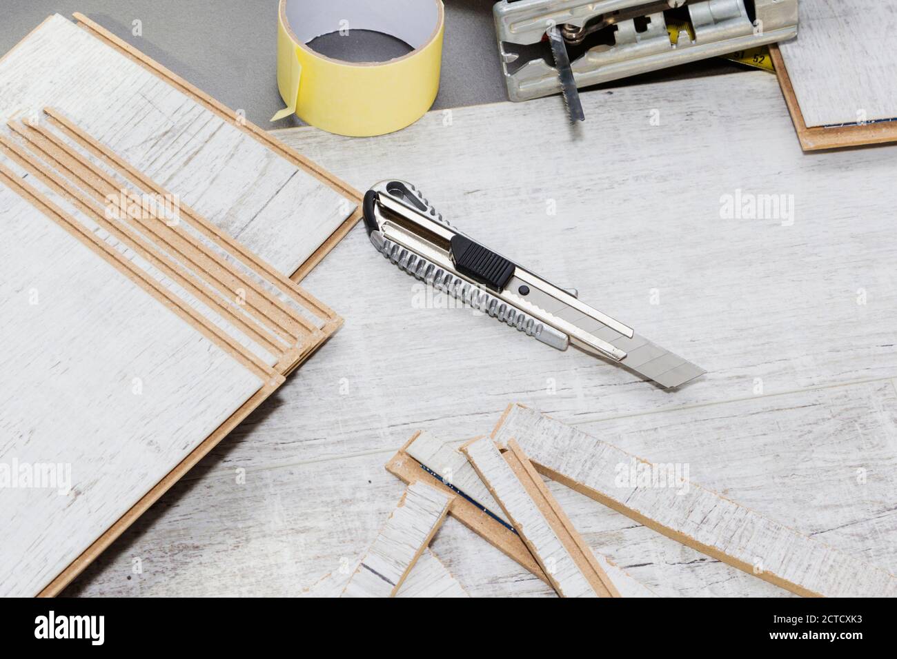 Planks of laminate floor and tools to install them Stock Photo Alamy