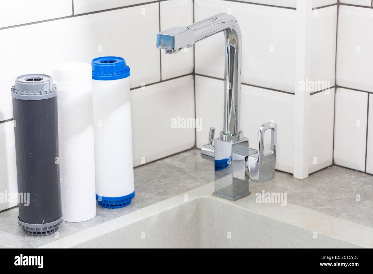 Replacing the water filter. Ecology. Clean water. Stock Photo