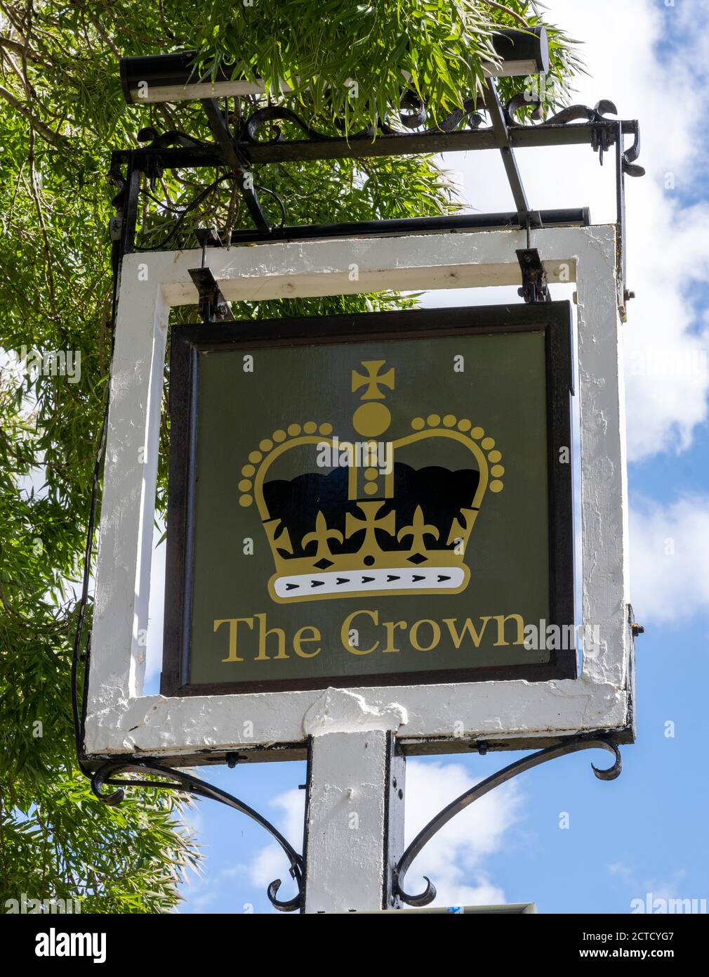 Traditional hanging pub sign at The Crown Public  House, Newbury Road, Kingsclere, Hampshire, England, UK Stock Photo