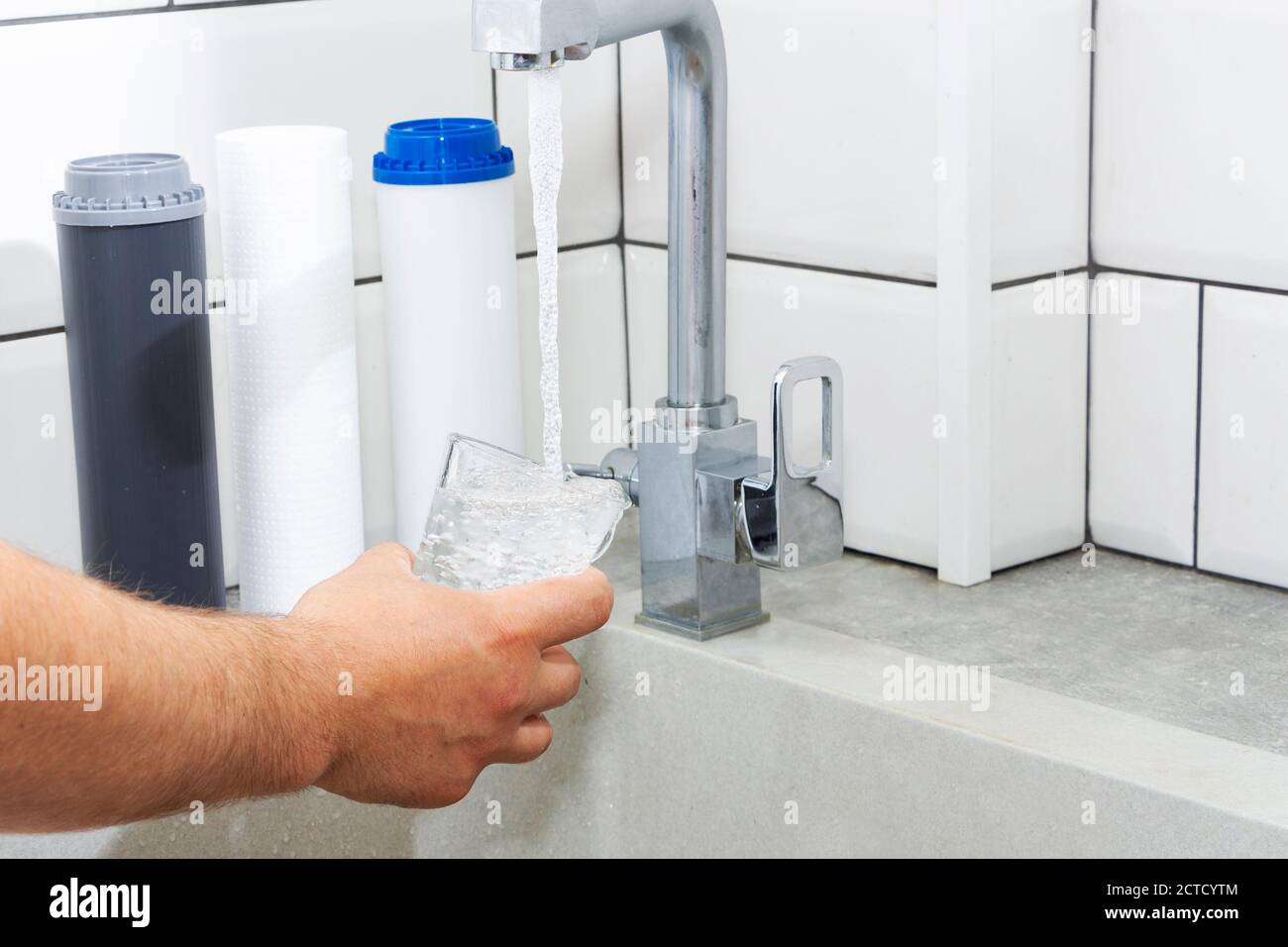 Replacing the water filter. Ecology. Clean water. Stock Photo