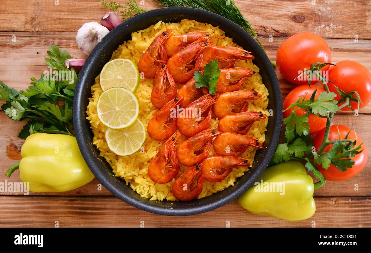 Rice paella with shrimp, saffron and olive oil - Spanish national dish Stock Photo