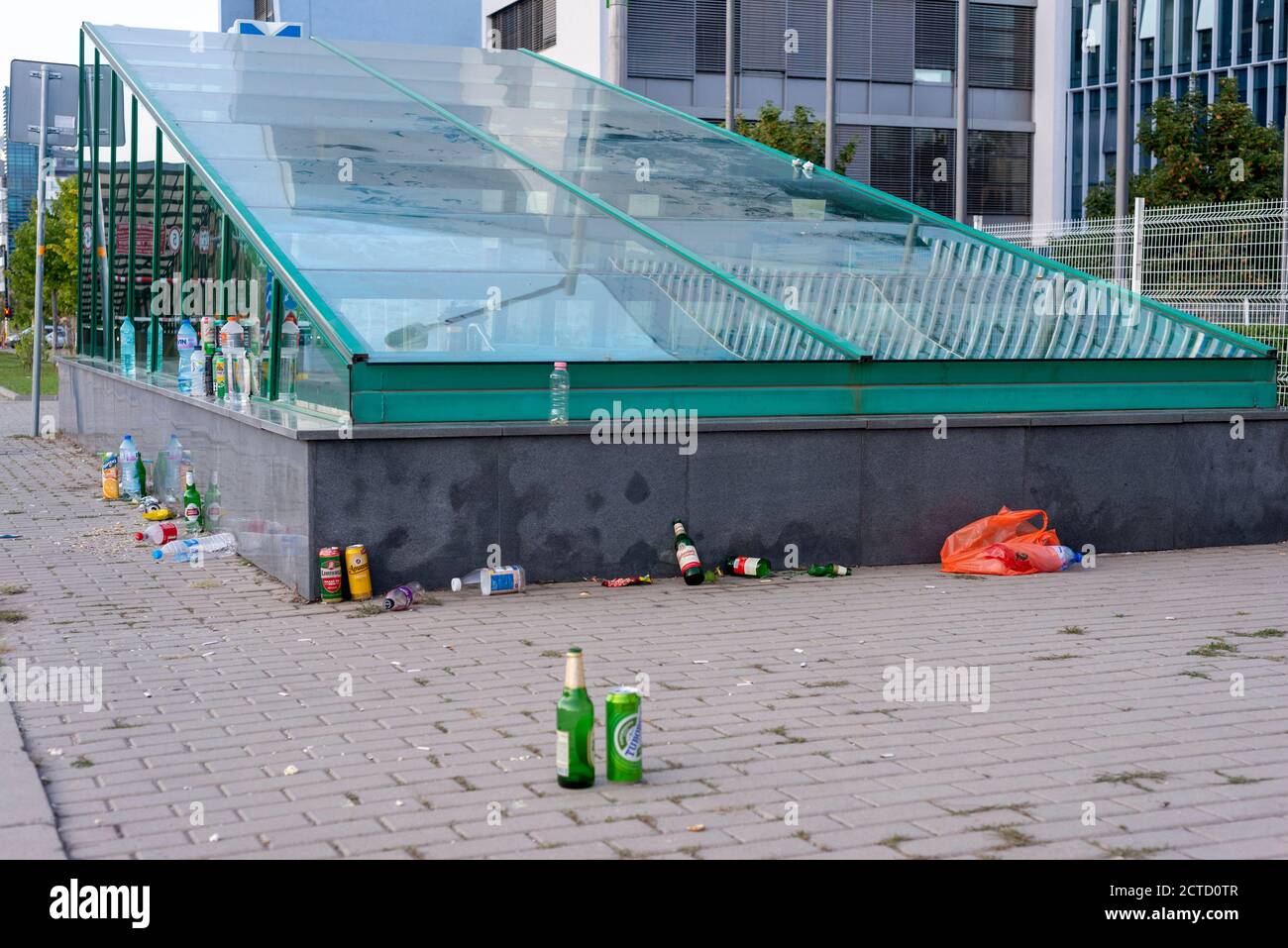 Empty bottles and other rubbish left after a street event at a metro