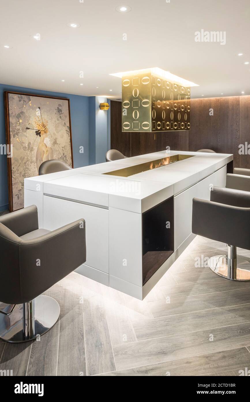 Haircut stations in a luxury hair salon between ground floor and basement  with bespoke furniture located in the heart of Soho, London, UK. Project  completed in November 2017 Stock Photo - Alamy