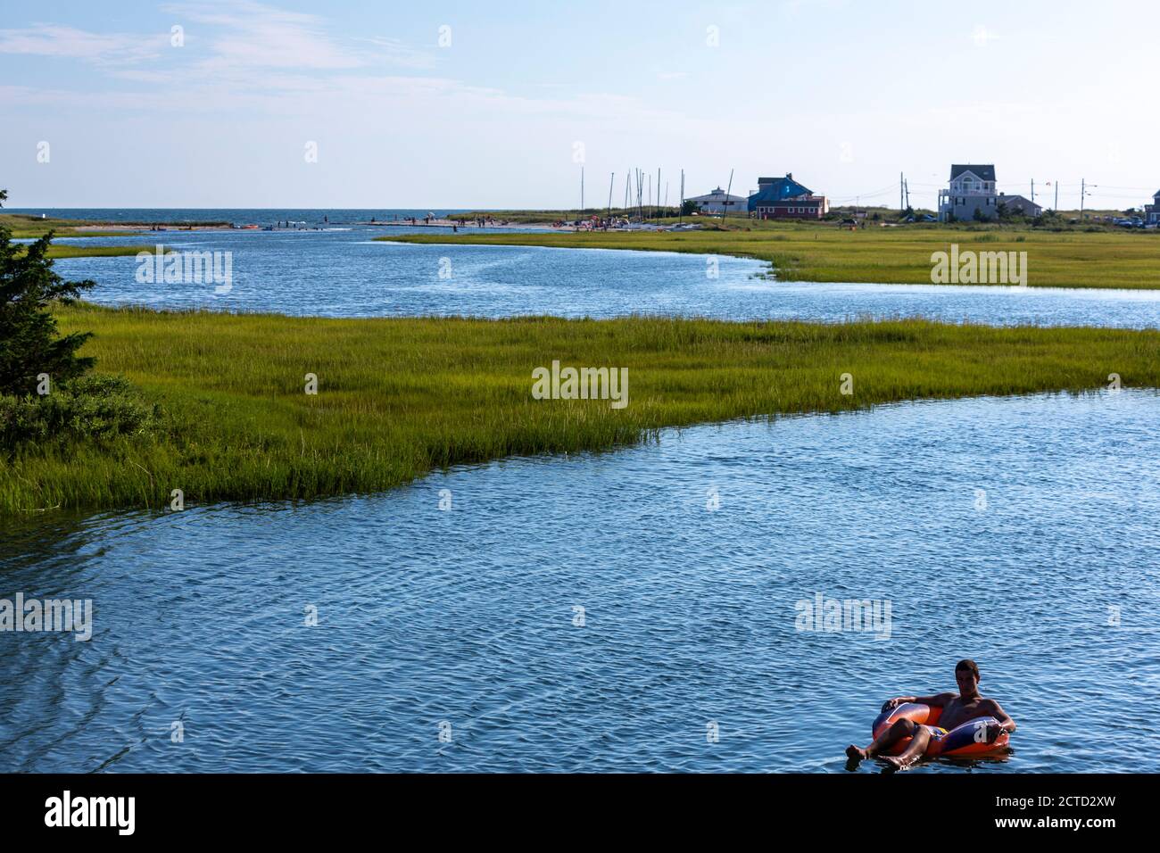 Man in inflatable boat, Swan pond River, Dennis Port, Massachusetts