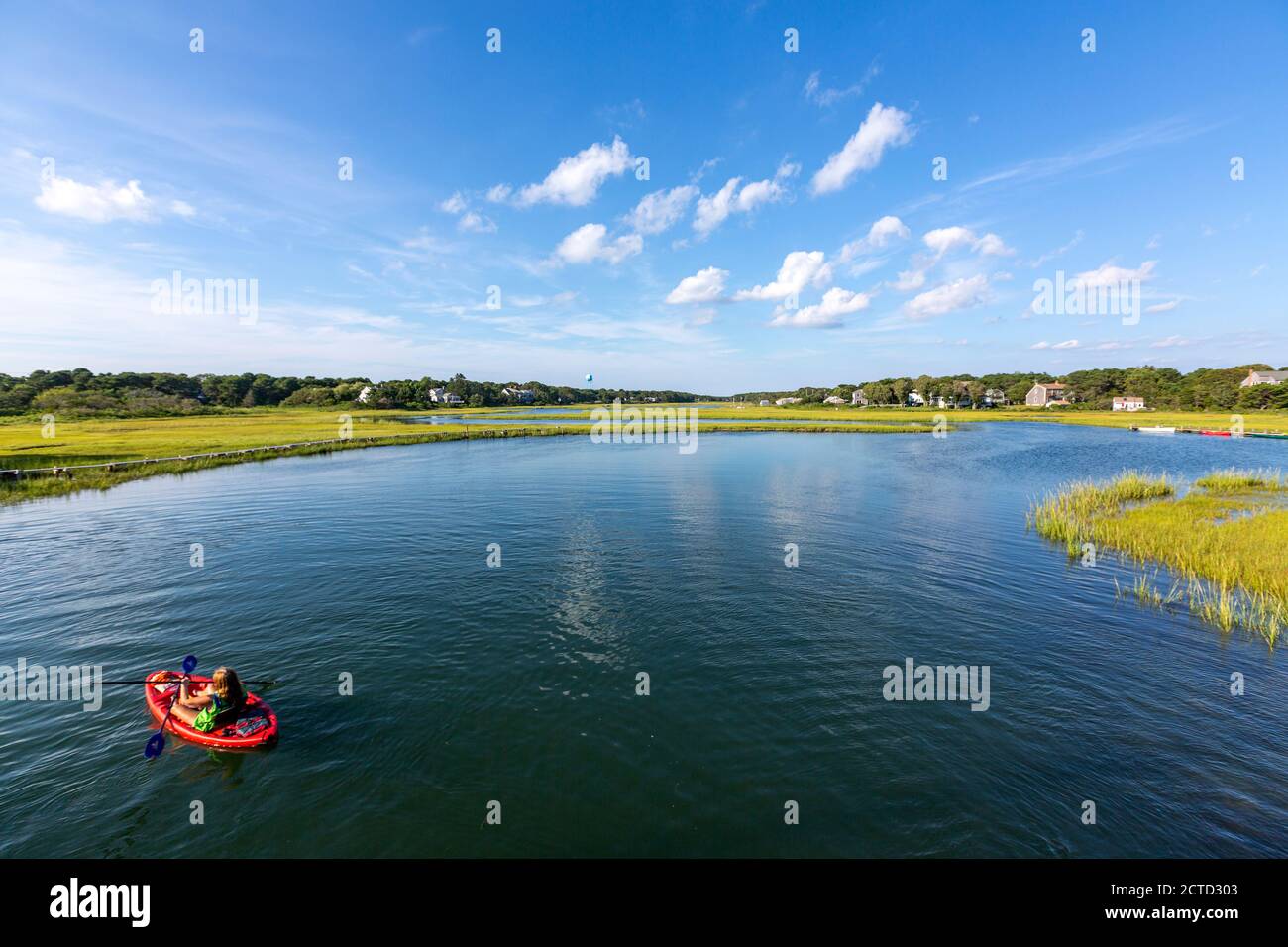 People in inflatable boat, Swan pond River, Dennis Port, Massachusetts
