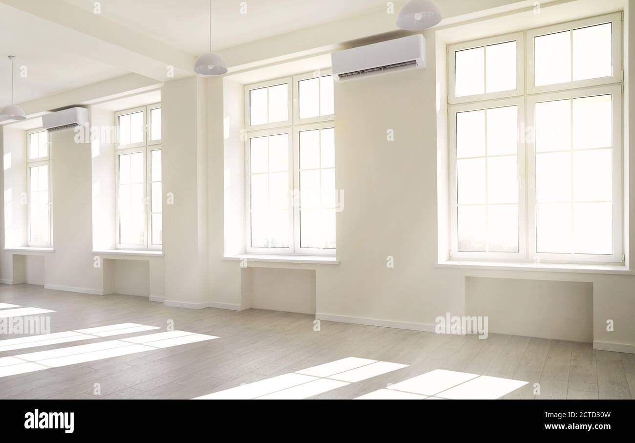 Empty light white room with window with sunlight. Stock Photo
