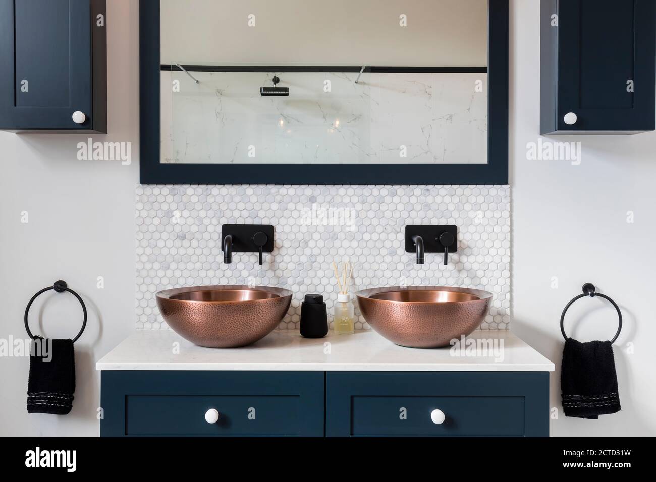 Brass and copperware basins in the bathroom of a Victorian house in