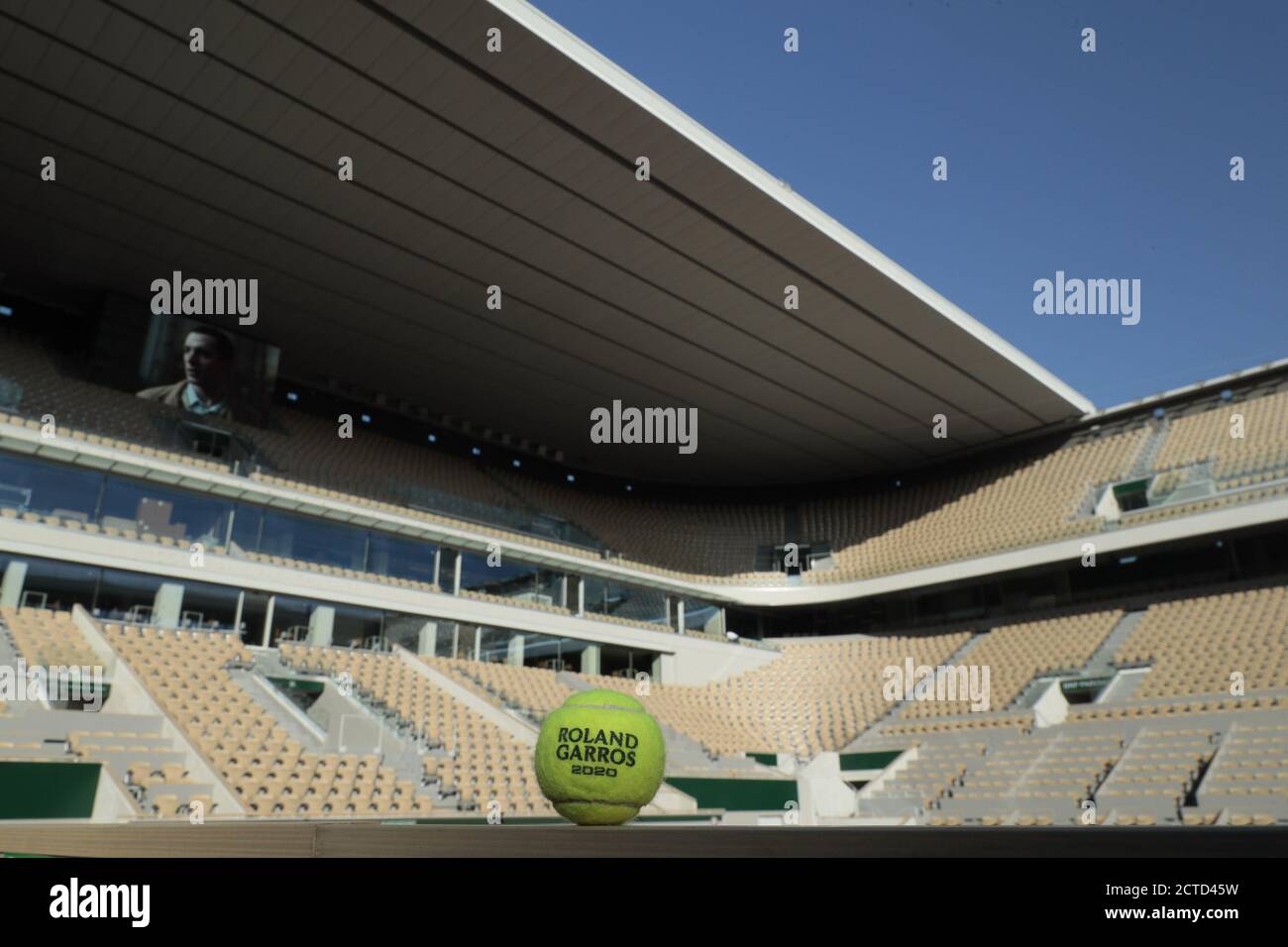 Illustration of official tennis ball Roland Garros 2020 by Wilson and the roof of Philippe Chatrier court under the CoVid health crisis 19 during the Stock Photo