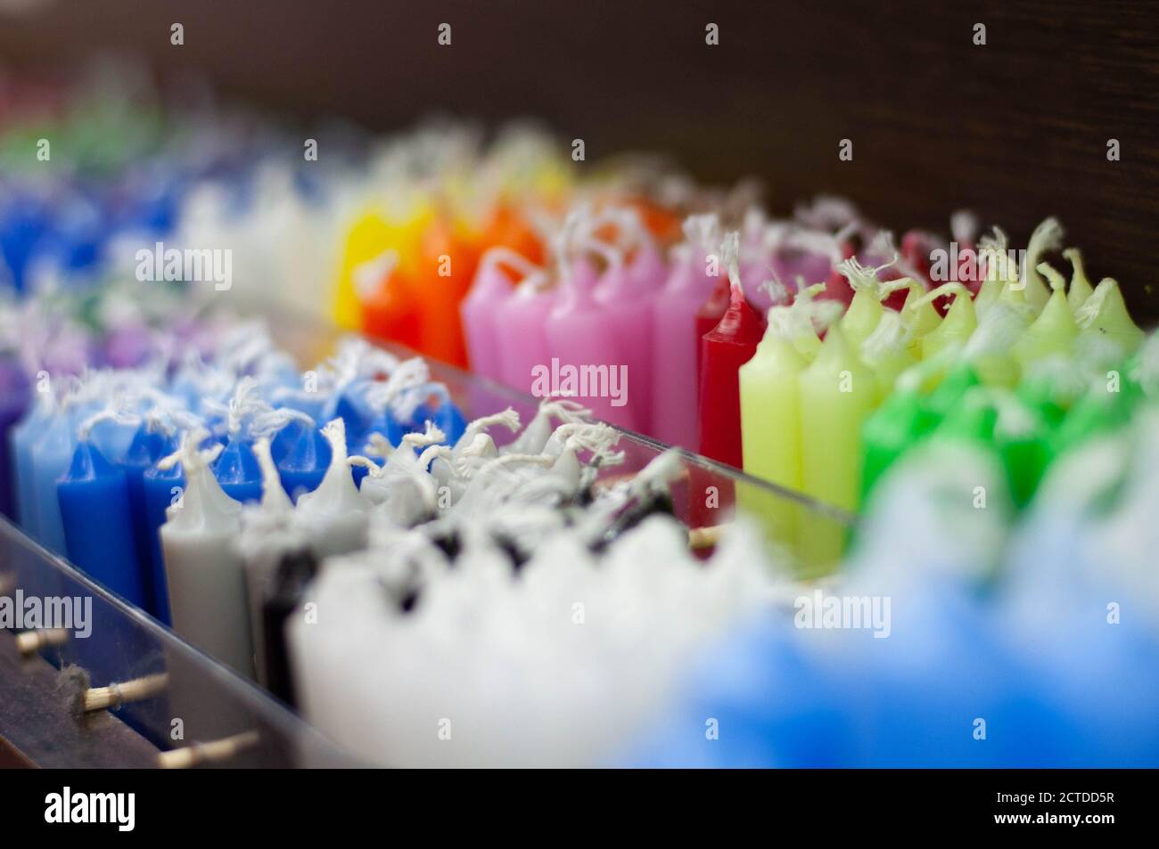 colored wax candles in the store Stock Photo Alamy