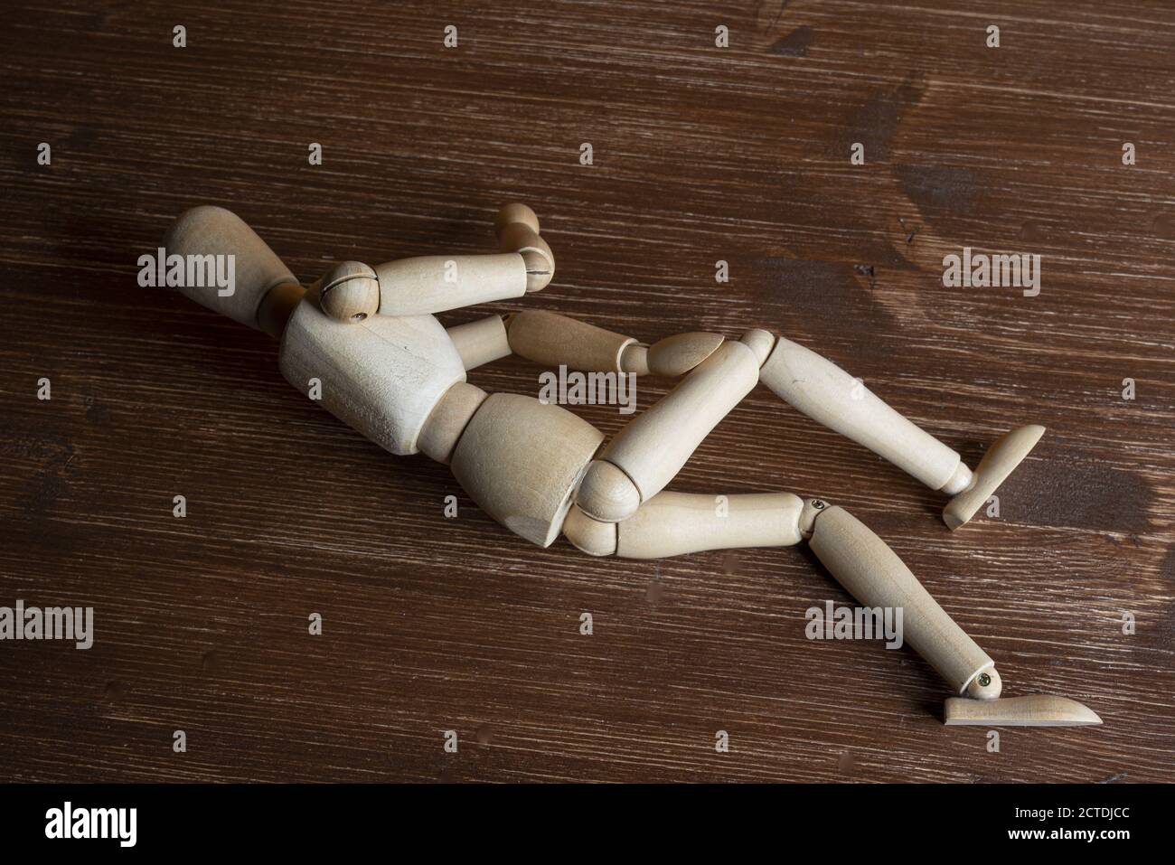 A wooden mannequin resting Stock Photo