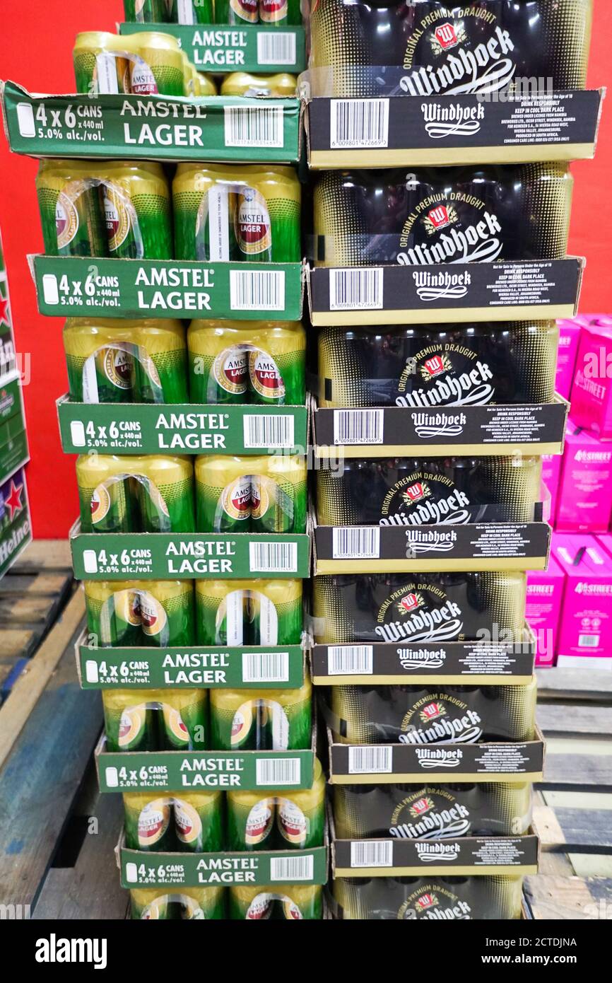 boxes of Amstel lager and Windhoek draught beer stacked one upon the other in a store in South Africa Stock Photo