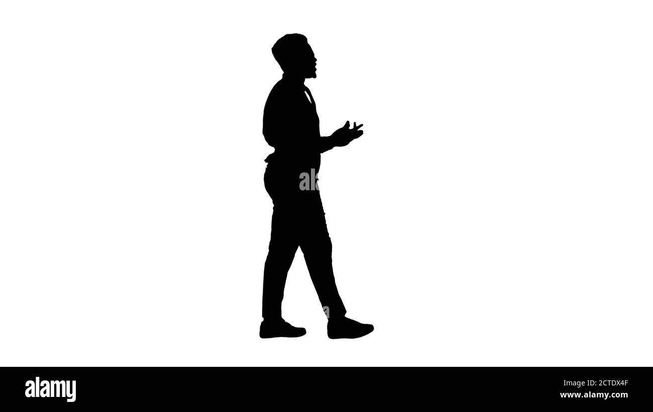 Silhouette Young African american businessman gesturing and talk Stock Photo