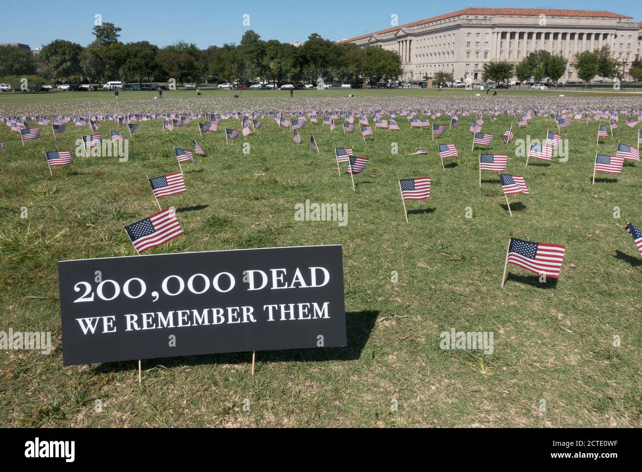 22 Sept. 2020: Some of the 20,000 American flags placed on the grounds of the Washington Monument, representing the 200,000 deaths due to Covid-19, a threshold just passed.  The flags were placed by the COVID Memorial Project, a local Washington, DC group. Stock Photo