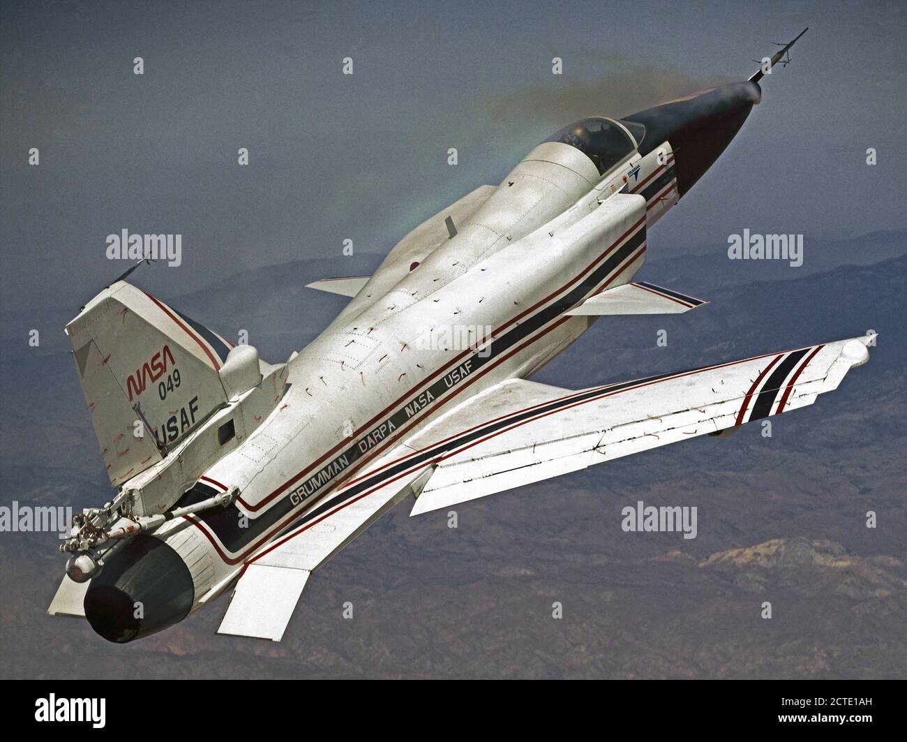 This photo shows the X-29 during a 1991 research flight. Smoke generators in the nose of the aircraft were used to help researchers see the behavior of the air flowing over the aircraft. The smoke here is demonstrating forebody vortex flow. This mission was flown September 10, 1991, by NASA research pilot Rogers Smith. Stock Photo