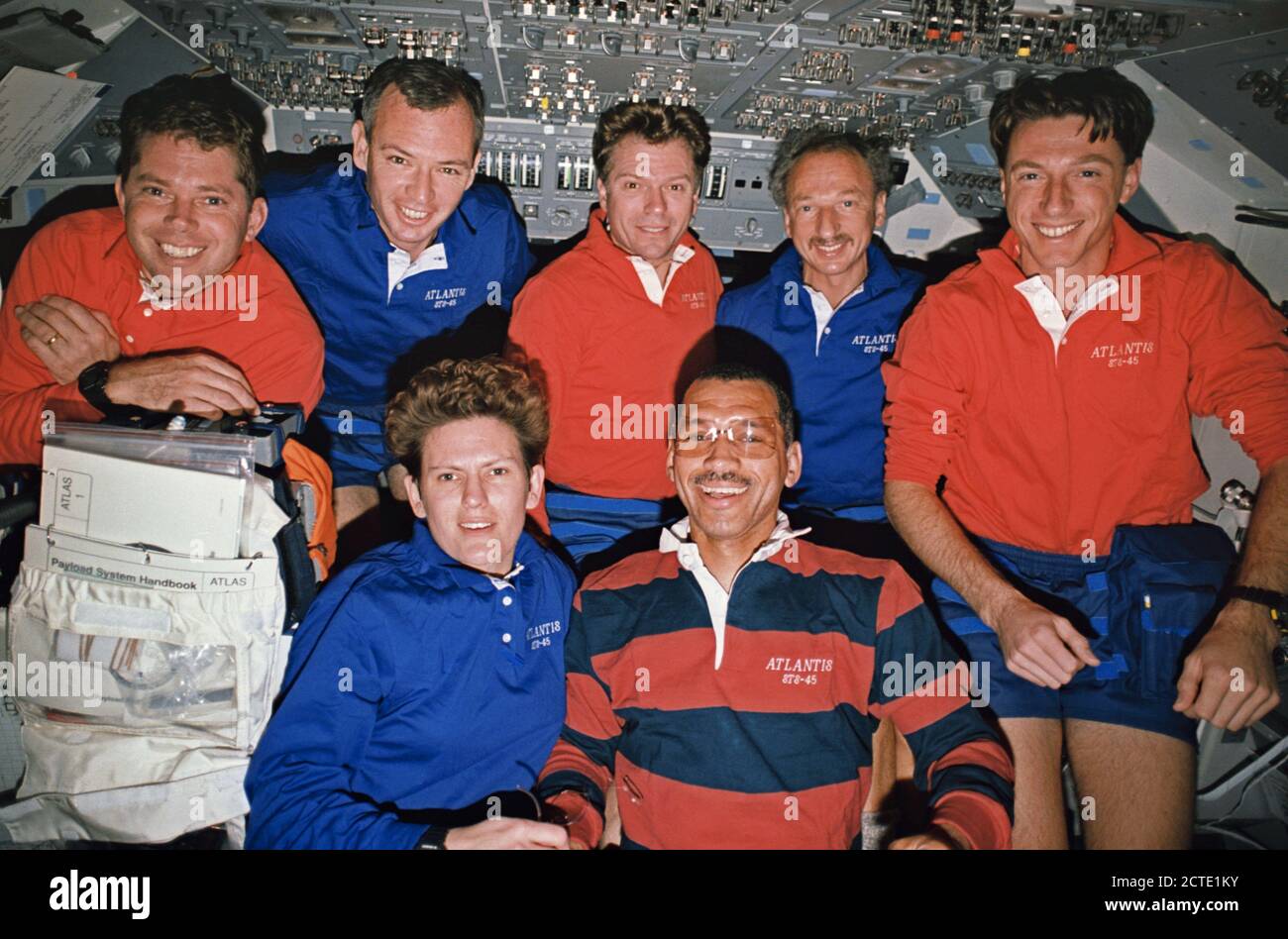 (24 March-2 April 1992)  --- The traditional inflight crew portrait has Kathryn D. Sullivan, payload commander,  and Charles Bolden, mission commander, on the front row, with ( left to right) David C. Leestma, mission specialist; Brian Duffy, pilot; Byron K. Lichtenberg and Dirk Frimout, both payload specialists; and C. Michael Foale, mission specialist, on the back row.  (The 'headpieces' worn by Sullivan and Bolden are actually shadows.)  This frame was taken with a 35mm camera on the flight deck of the Earth-orbiting Space Shuttle Atlantis during the nine-day mission. Stock Photo
