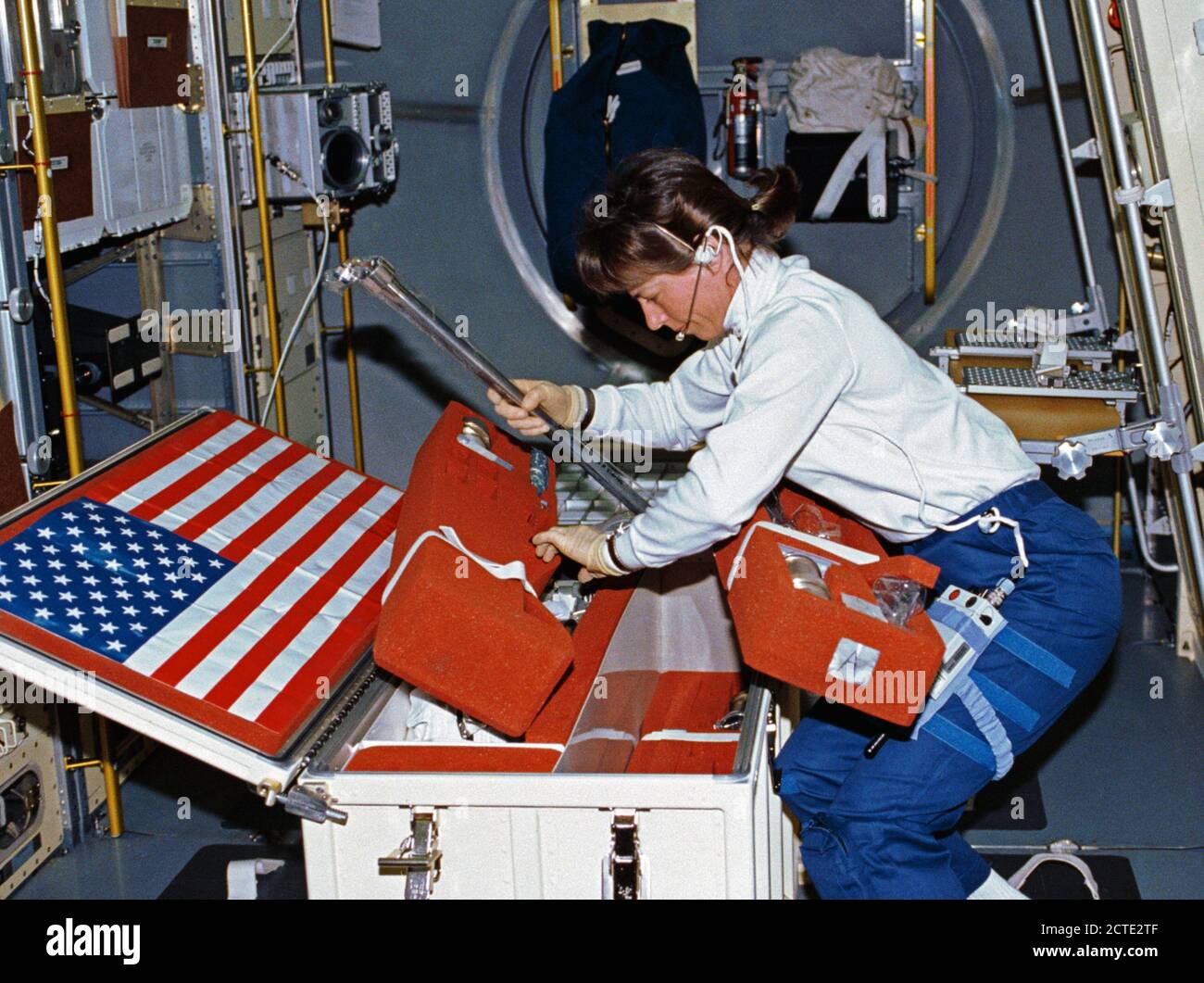 (25 June-9 July 1992) --- Astronaut Bonnie Dunbar, payload commander, unstows United States Microgravity Laboratory 1 (USML-1) experiment paraphernalia in early stages of the mission. Stock Photo
