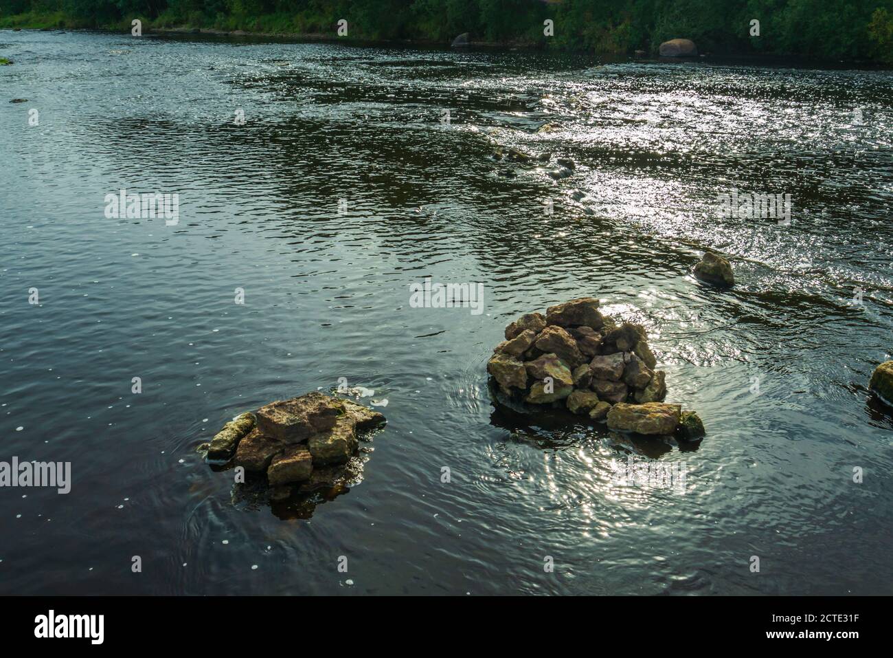 A bunch of rocks in the running water Stock Photo - Alamy