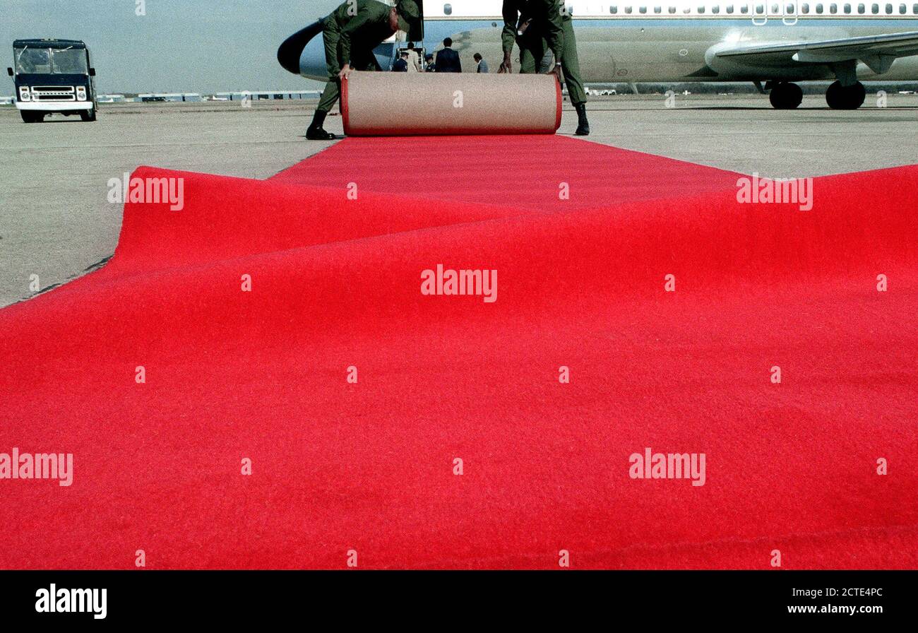 1980 - Airmen place a red carpet on the ground for Prime Minister Menachem Begin of Israel prior to his departure from the United States after his visit. Stock Photo