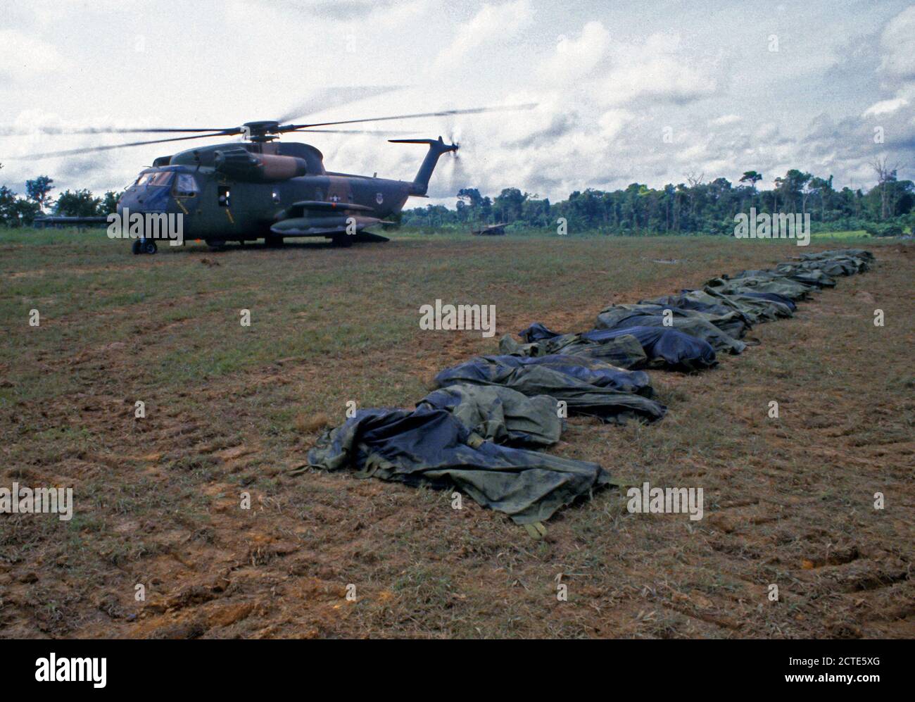 1978 - A US Air Force HH-53 Jolly Green Giant helicopter from the 55th Aerospace Rescue and Recovery Squadron stands by to assist in the removal of the remains of the victims of the Jonestown tragedy. Stock Photo