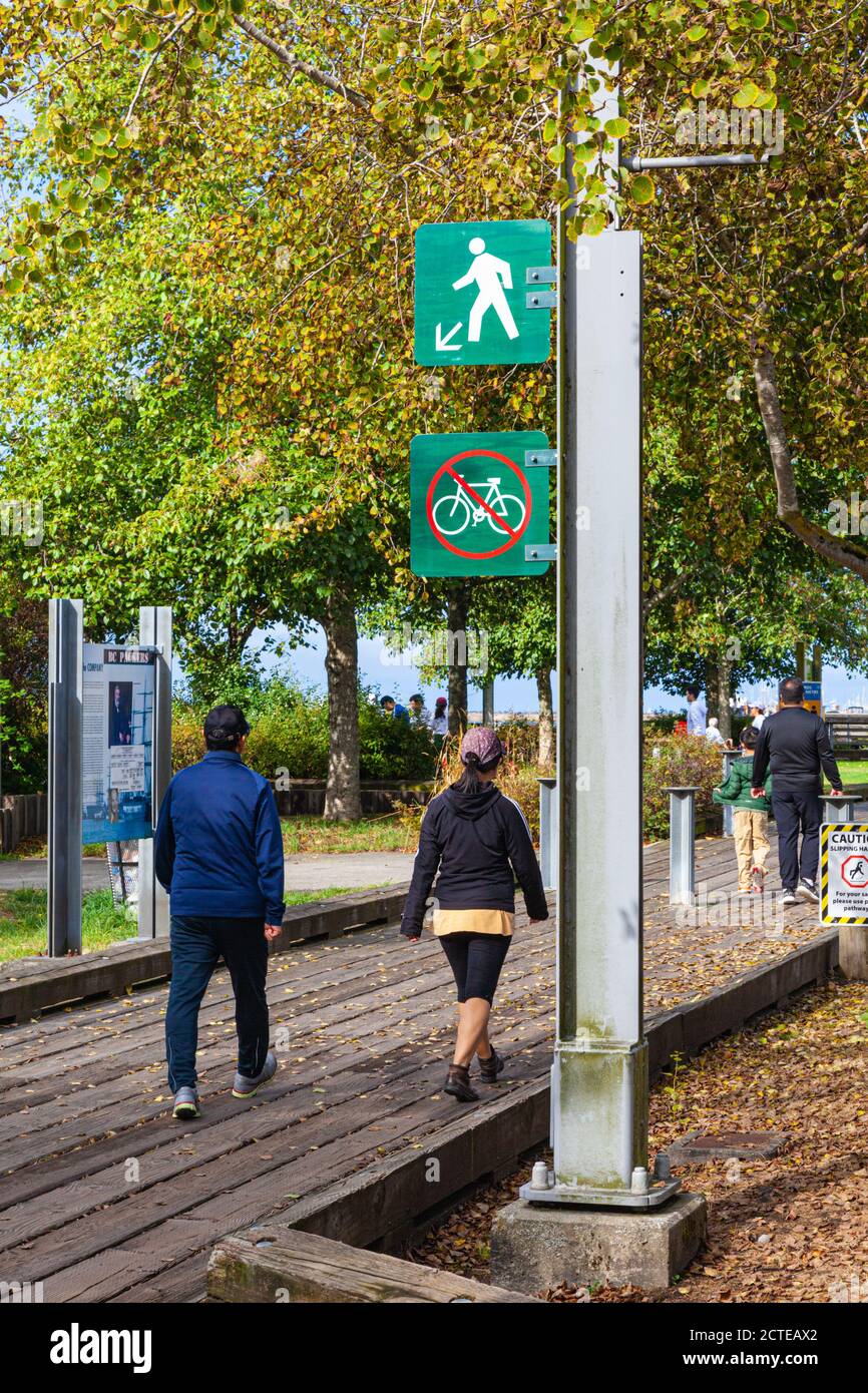 People on the boardwalk along the Steveston waterfront British Columbia Canada Stock Photo