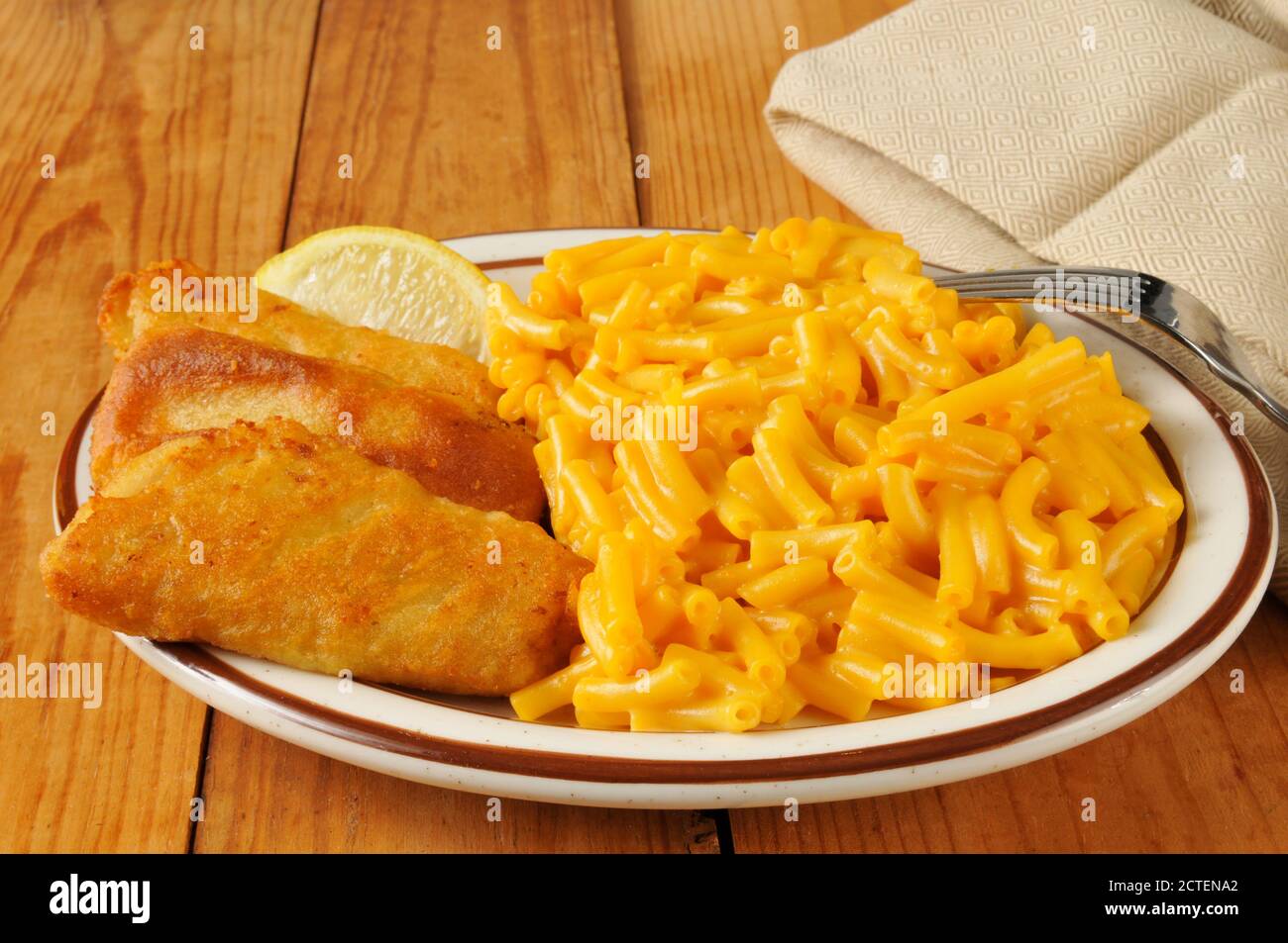 Beer battered fish sticks with macaroni and cheese Stock Photo Alamy