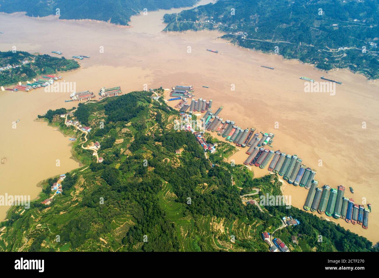 An aerial view of lines of ships wait in queue on the Yangtze River to get through the Three Gorges Dam, which halted vessel passing for 174 hours to Stock Photo