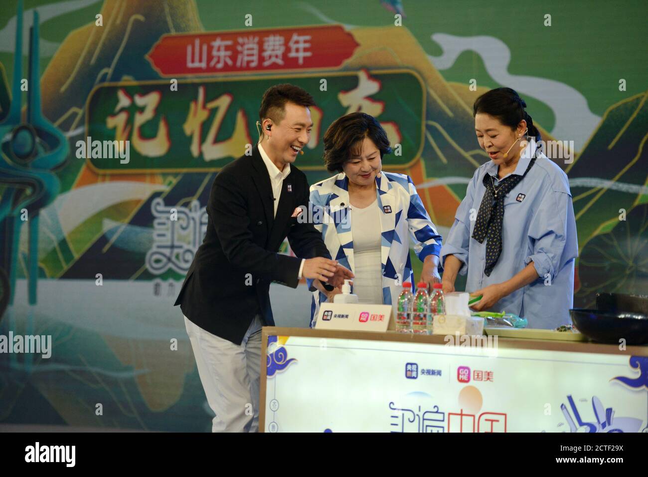 Chinese news anchor Kang Hui, left, Chinese film actress and TV host Ni Ping, right, and Chinese child program host Ju Ping, middle, together attend a Stock Photo