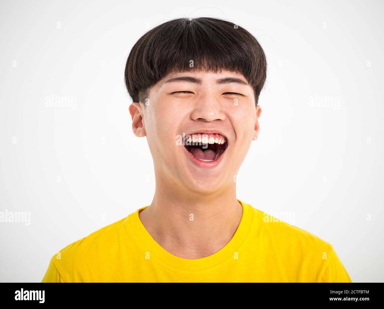 Close up portrait of a smiling teenage Asian boy Stock Photo