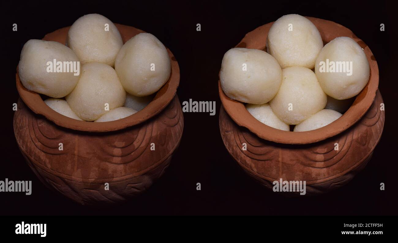 Rasgulla a traditional Indian Bengali sweet served in two earthen pots ...