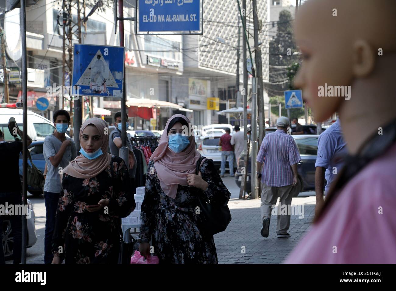Gaza City. 22nd Sep, 2020. Palestinians wearing face masks walk on a street in Gaza City on Sept. 22, 2020. Palestine on Tuesday recorded 557 new cases infected with the novel coronavirus, bringing the total number of infections to 46,614. In the Gaza Strip, the Hamas-ruled government has recently eased the coronavirus restrictions. Credit: Rizek Abdeljawad/Xinhua/Alamy Live News Stock Photo