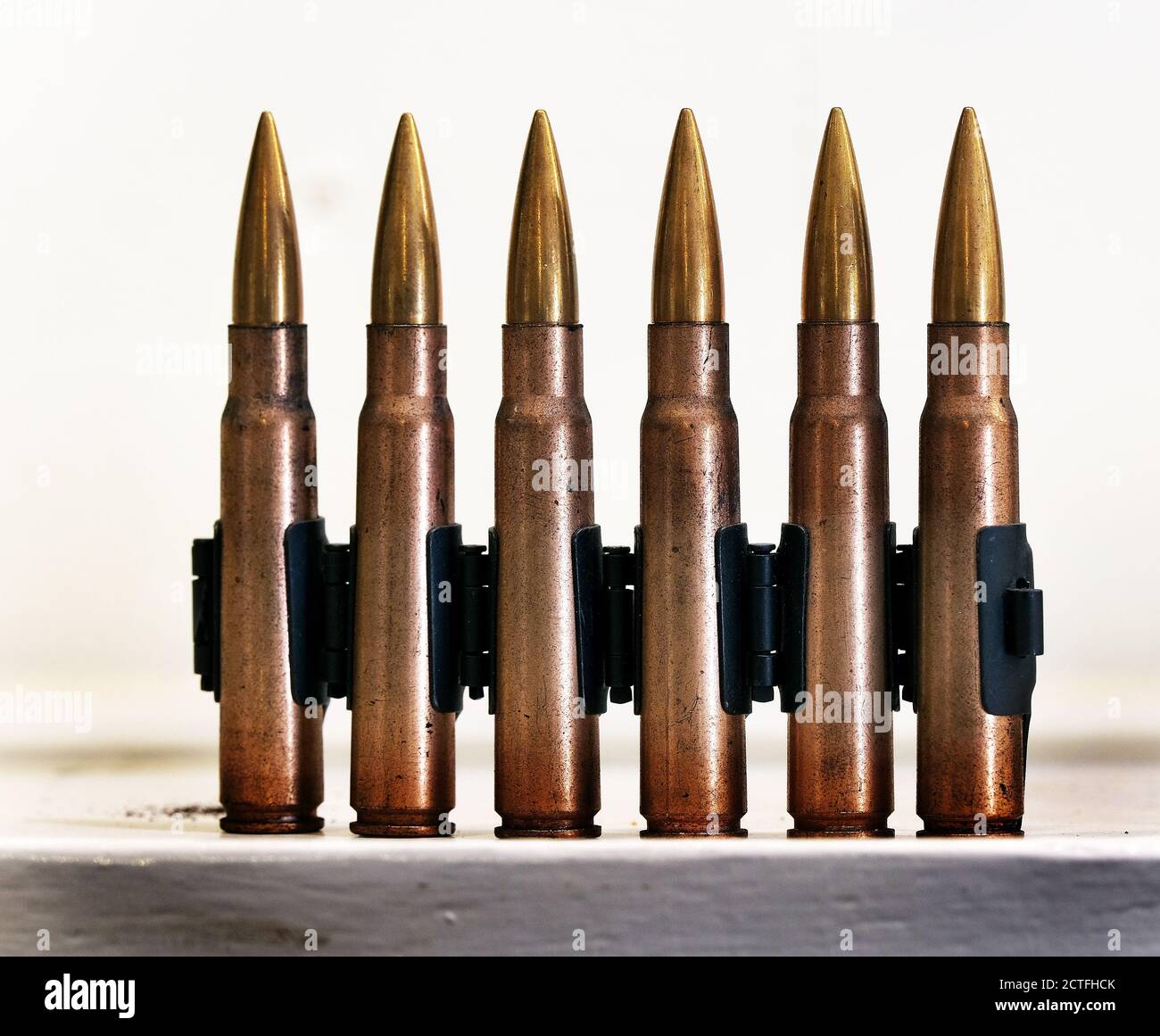 British 0.303 cartridges in machine gun feed link. Stock Photo